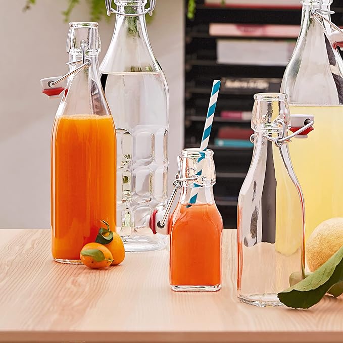 Bormioli Rocco Swing Top Glass Bottle (Set of 2) - 17 oz Reusable Container with Secure Metal Clasp, Ideal for Homemade Juices, Oil Infusions, Condiments, Mixers - Everyday Drinking Glasses